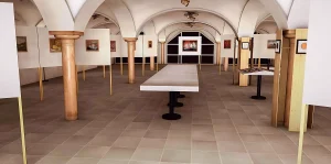 Visualisierun einer Kunstausstellung im Säulenfoyer des Schauspielhauses in Salzburg. Im Raum mit Säulen stehen Wände und Tische auf denen die Kunstwerke präsentiert werden. Auf den Wänden hängen Bilder.