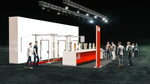 Messestand mit Glastüren und einem großen rot-weißen Pult mit dem Logo des Feuerschutz Teams. Um und auf dem Messestand gehen Menschen herum.