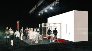 Messestand mit Glastüren und einem großen rot-weißen Pult mit dem Logo des Feuerschutz Teams. Um und auf dem Messestand gehen Menschen herum.